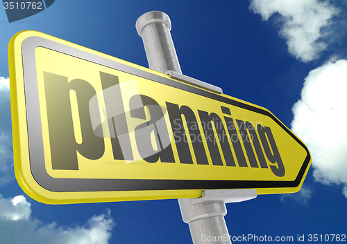 Image of Yellow road sign with planning word under blue sky
