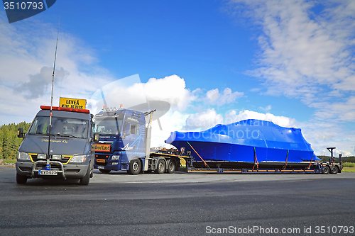 Image of Pilot car and Exceptional Load at Truck Stop