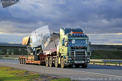 Image of Scania 164 V8 Truck Hauls Terex Pregon Crusher