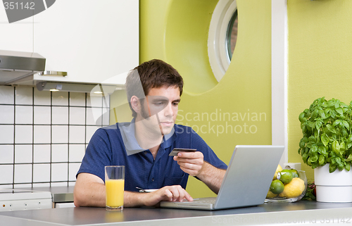 Image of Online Shopping in Kitchen