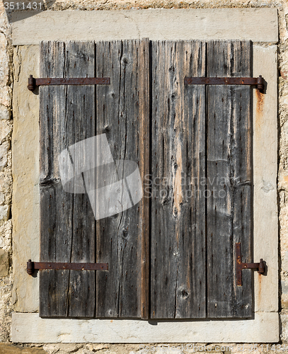 Image of old window with shutters