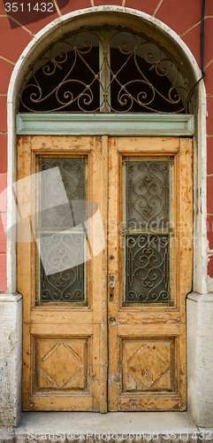 Image of old ragged shabby wooden door