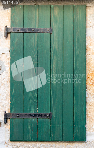 Image of old window with   wooden shutters