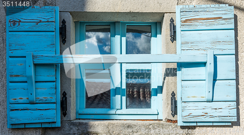 Image of old window with shutters 