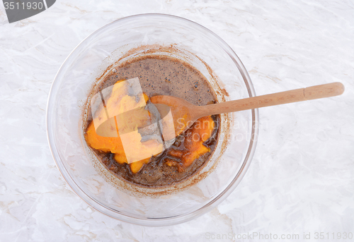 Image of Stirring pureed pumpkin into pie filling