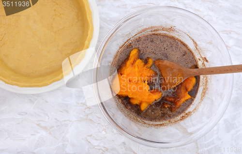 Image of Pastry case with bowl of pie filling and pureed pumpkin