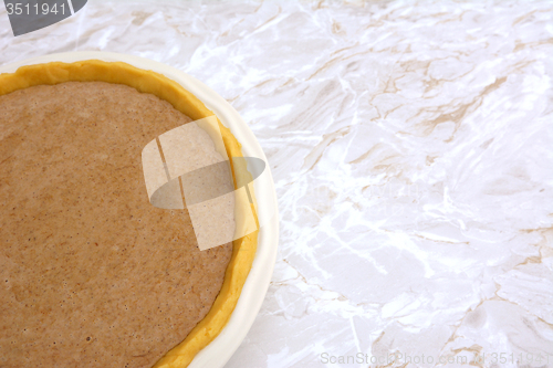 Image of Pie shell filled with pumpkin pie filling