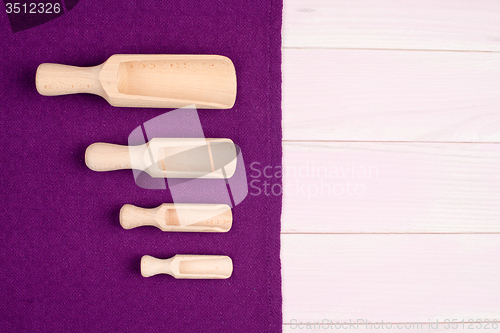 Image of Kitchenware on purple towel