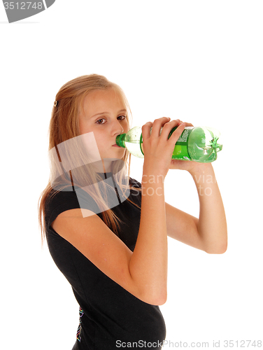 Image of Girl drinking pop from bottle.