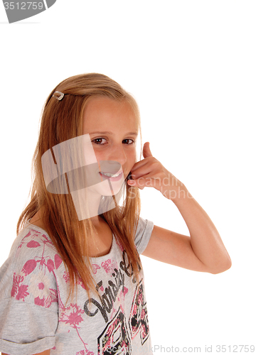 Image of Young girl gesturing a phone call.