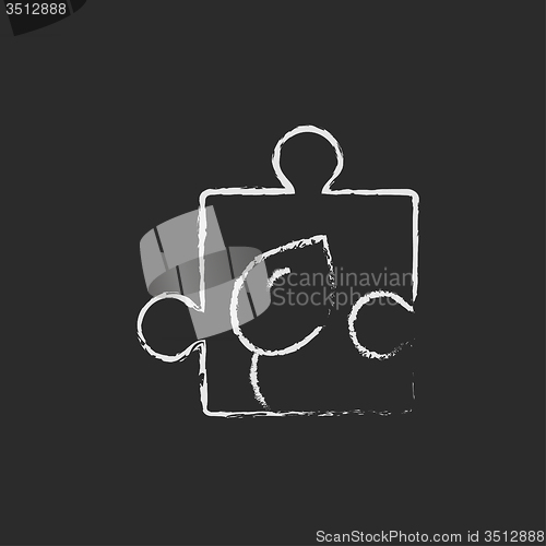 Image of Puzzle with leaf icon drawn in chalk.