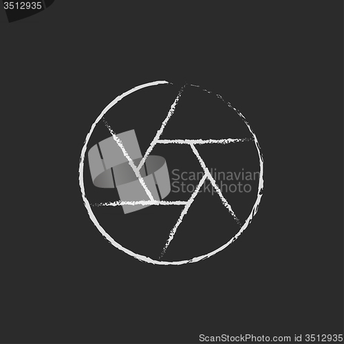 Image of Camera shutter icon drawn in chalk.