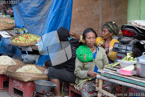 Image of Hindu peoples at the traditional street market, Bali