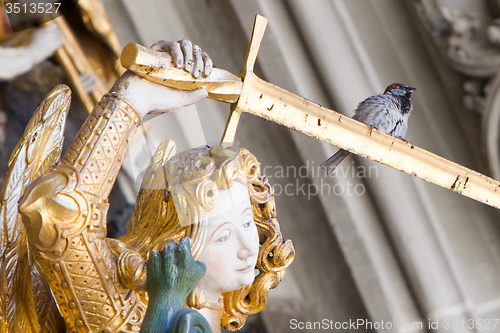 Image of Berner Muenster, sparrow sitting on a sword