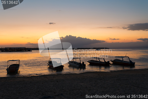 Image of Nusa penida, Bali beach with dramatic sky and sunset