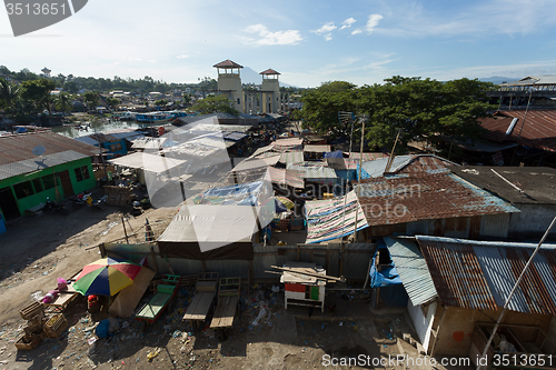 Image of Straw poor houses by the river