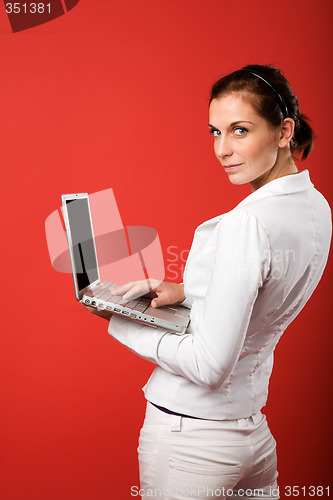 Image of Female with Computer on Red