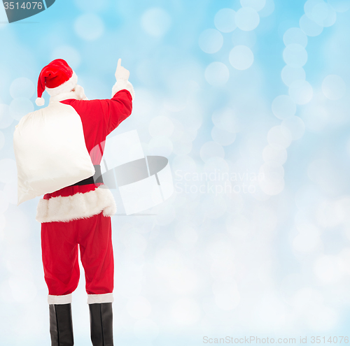 Image of man in costume of santa claus with bag