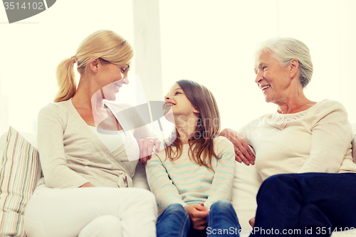 Image of smiling family at home