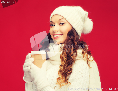 Image of woman in hat with takeaway tea or coffee cup