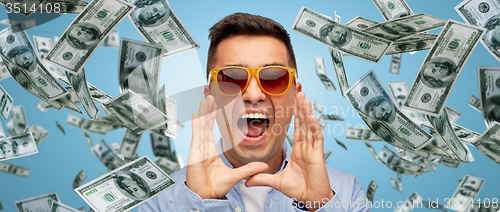 Image of face of shouting man with falling dollar money