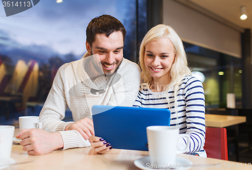 Image of happy couple with tablet pc and coffee at cafe