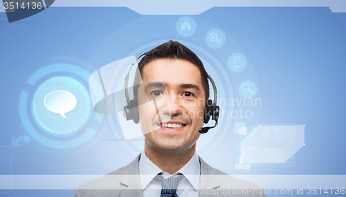 Image of smiling businessman in headset over virtual screen