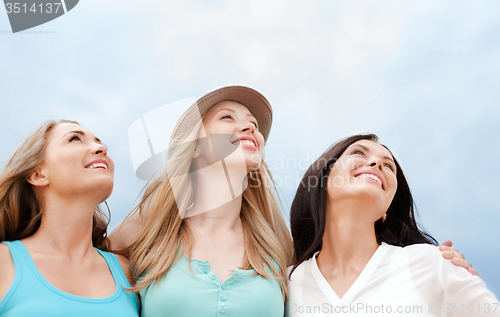 Image of girls looking up in the sky