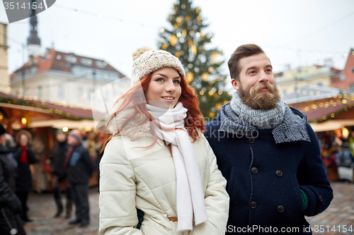 Image of happy couple walking in old town