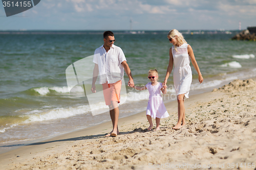 Image of happy family in sunglasses on summer beach