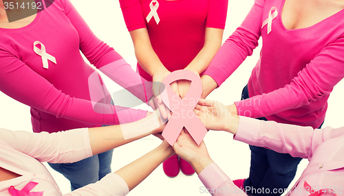 Image of close up of women with cancer awareness ribbons