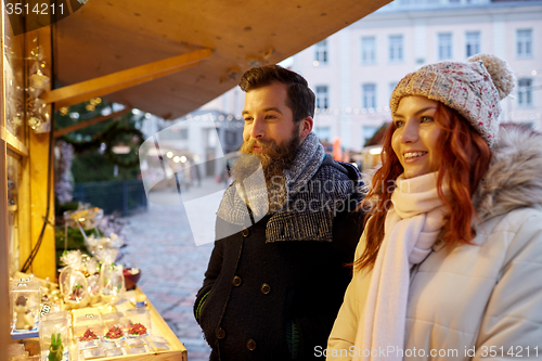 Image of happy couple walking outdoors