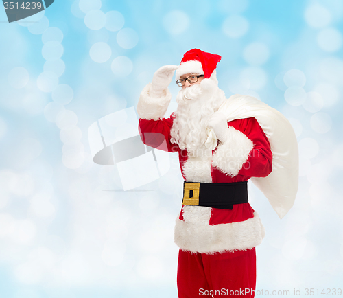 Image of man in costume of santa claus with bag