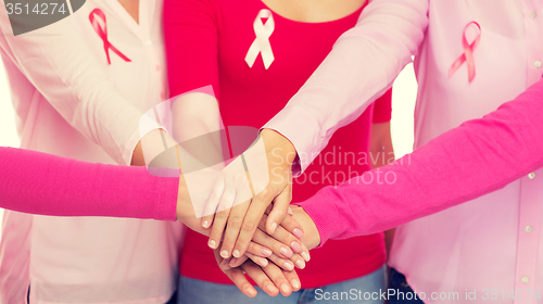 Image of close up of women with cancer awareness ribbons