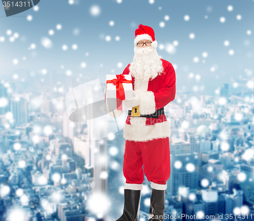 Image of man in costume of santa claus with gift box