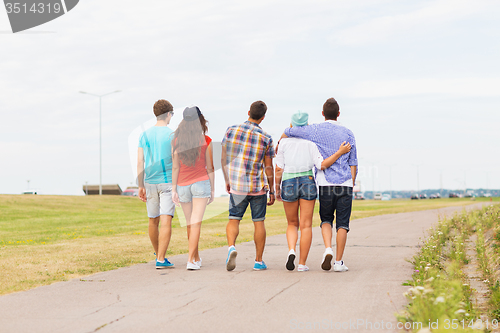 Image of close up of teenage friends walking outdoors