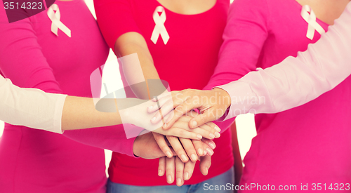 Image of close up of women with cancer awareness ribbons