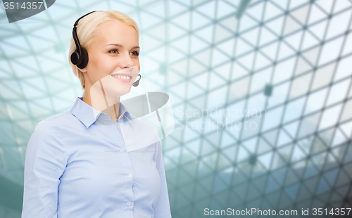 Image of helpline operator in headset over grid background