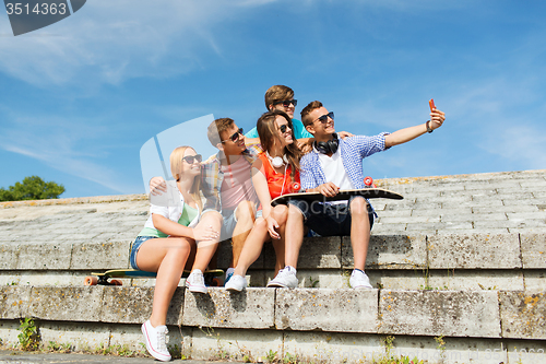 Image of happy friends with smartphone taking selfie