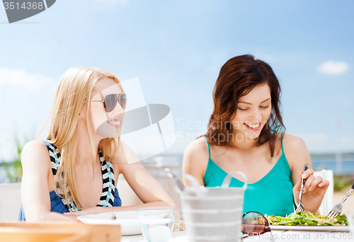 Image of girls in cafe on the beach