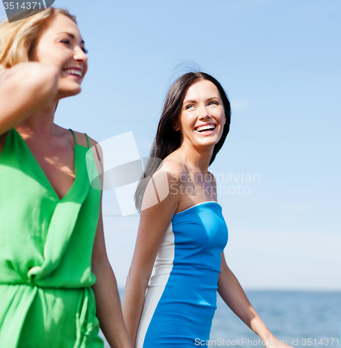 Image of girls walking on the beach