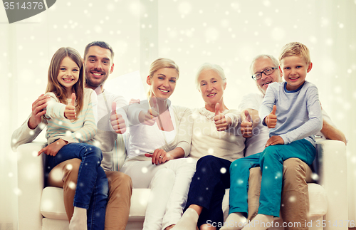 Image of happy family sitting on couch at home