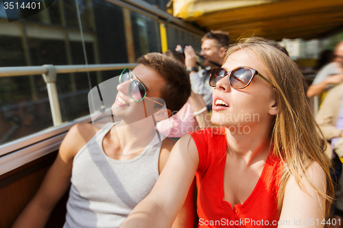 Image of happy teenage couple traveling by tour bus