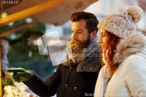 Image of happy couple walking outdoors