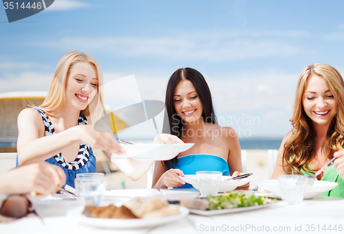 Image of girls in cafe on the beach