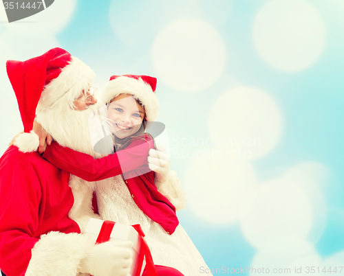 Image of smiling little girl with santa claus