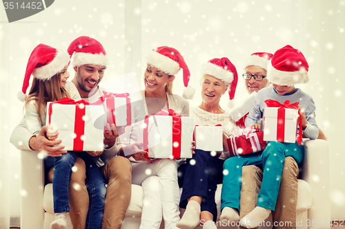 Image of happy family sitting on couch at home