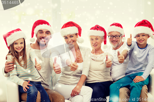 Image of happy family sitting on couch at home