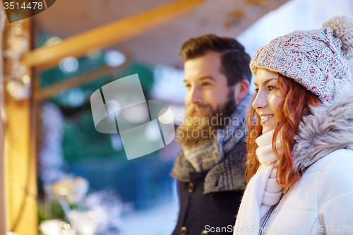 Image of happy couple walking outdoors