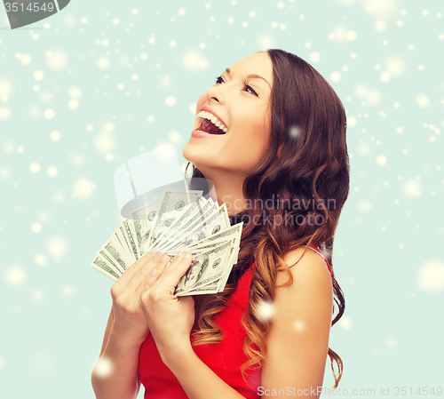 Image of woman in red dress with us dollar money